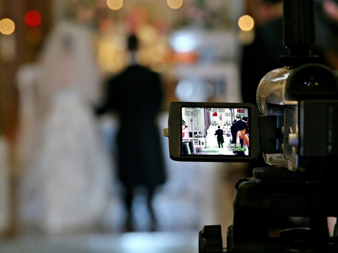 新加坡富豪新郎婚宴上插播新娘「偷情影像」。（示意圖片，與新聞當事人無關）