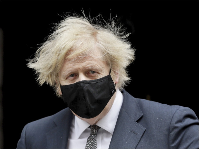 约翰逊表明支持被中方制裁的9名英国公民。AP资料图片