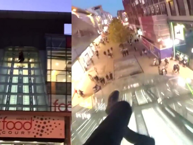 英国一名男子从距离地面约15米高的玻璃外墙顶处滑落地面，并拍摄片段分享，惹来网民狂轰。（网图）