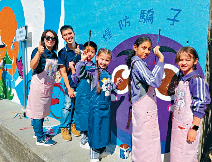 「画美丽香港」带领义工和南丫北段公立小学学生，设计及绘制壁画。