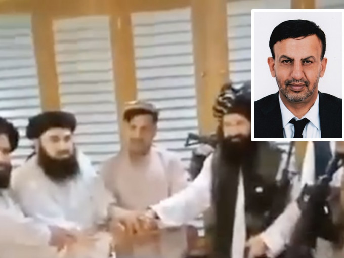 网上疯传哈什马特与塔利班人员握手画面。网图