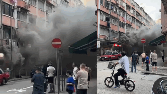大量浓烟涌出锦荣街，弥漫整条街道。