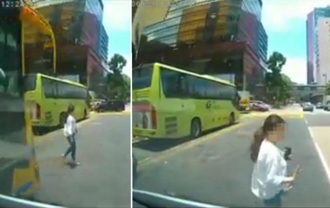 由于旅游巴阻挡视线，一名女子几乎被车辆撞倒。香港交通突发报料区FB图片