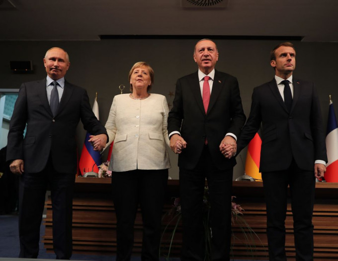俄羅斯總統普京、德國總理默克爾、土耳其總統埃爾多安、法國總統馬克龍。AP