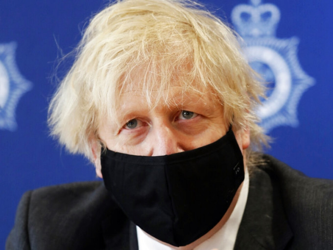英国首相约翰逊对中国新疆及香港的人权状况表示关注。AP图片