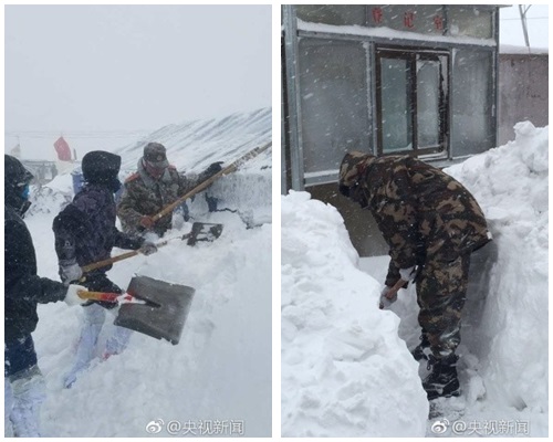 当地出动官兵铲雪。图：央视