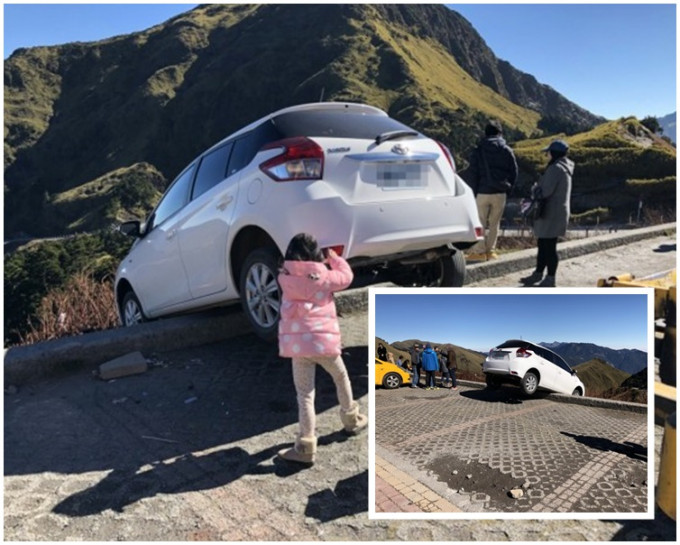 車子一半在護欄外，還幸有驚無險。