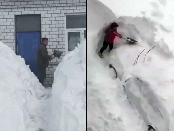齐齐哈尔遇37年来最大暴雪，居民爬窗出门、雪堆挖汽车。(网图)