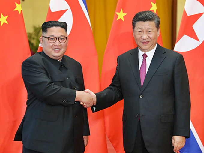 中國國家主席習近平（右）及北韓領袖金正恩（左）。新華社圖片