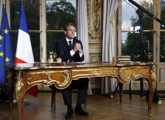 法国总统马克龙誓言五年内重建圣母院。AP