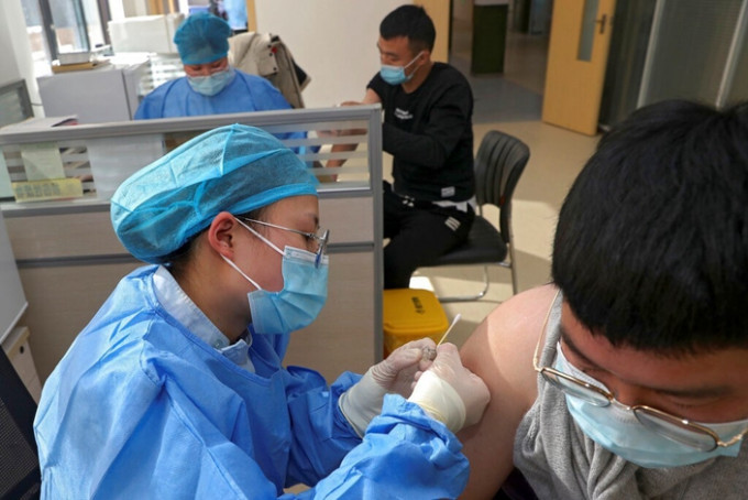 新冠疫情在中国受控显示中国体制优胜。（AP图片）