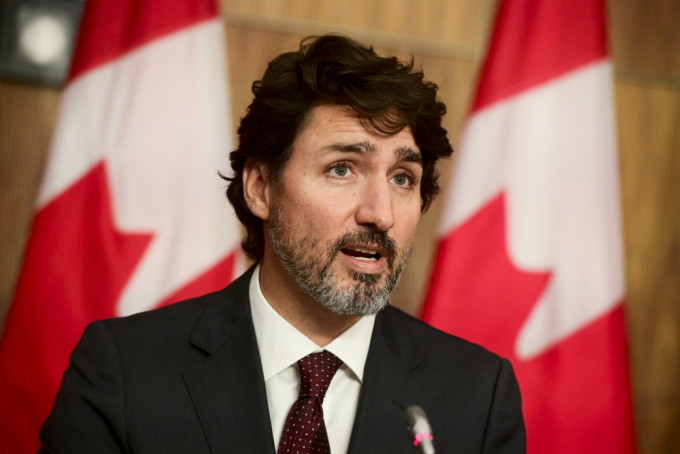 加拿大总理特鲁多和其他自由党内阁成员均没出席投票。AP资料图片。