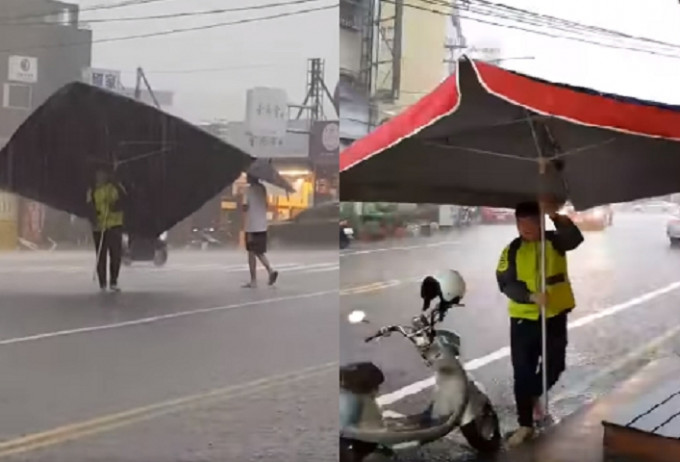 一名身穿营光黄色外套的男子在倾盆大雨中，撑著一把「巨伞」。网图