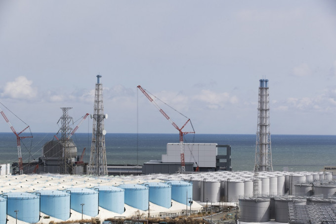 福岛第一核电厂两名员工疑受辐射污染。AP图片