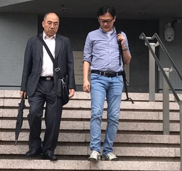 陸劍青（右）被房屋署票控於申報時作虛假陳述，今於裁判法院認罪。