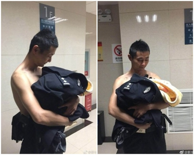 警員吳宇馬上脫下制服，緊緊將嬰兒抱在懷裡。網圖