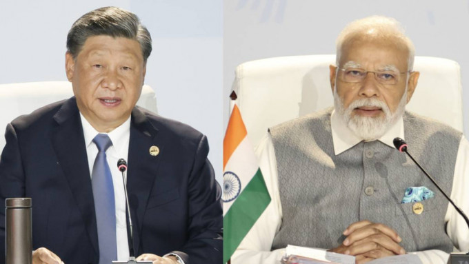 國家主席習近平與印度總理莫迪於金磚峰會期間交談。（中新社）