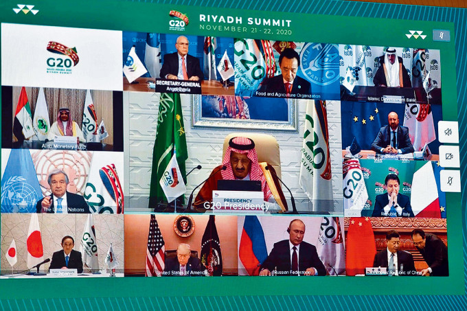 ■習近平（下排右一）和特朗普（下排左二）出席G20視像峰會。