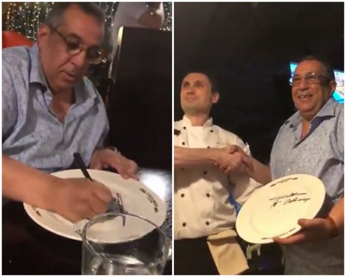 餐厅主厨亲自拿著餐盘请「总理」签名，两人还握手合照。网图
