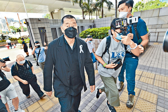 壹傳媒集團創辦人黎智英等十五人，昨再度在西九龍裁判法院提訊。