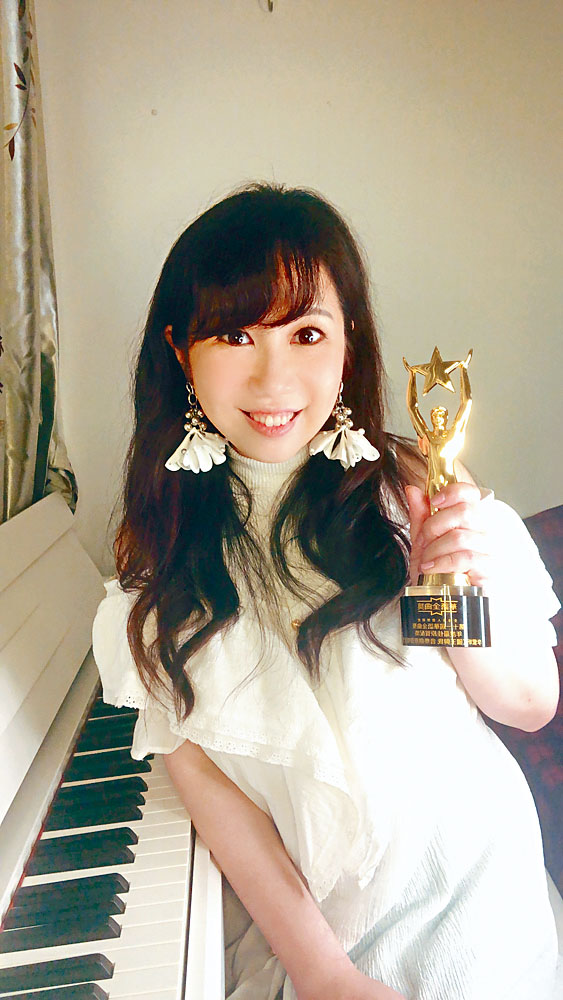 李紫昕凭《国王与我》原声大碟在华语金曲奖中连夺两奖。