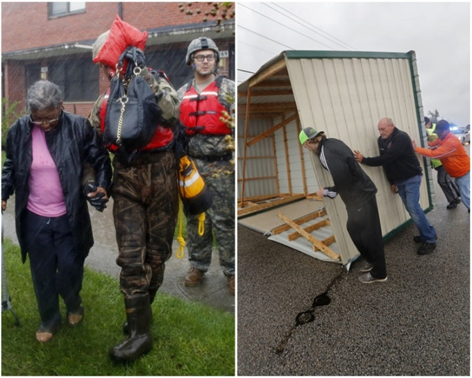 救援人员最少救出200名被困洪水的居民。AP