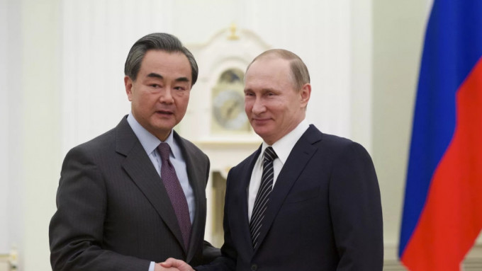 王毅訪問莫斯科期間與普京會晤。 俄羅斯衛星通訊社圖