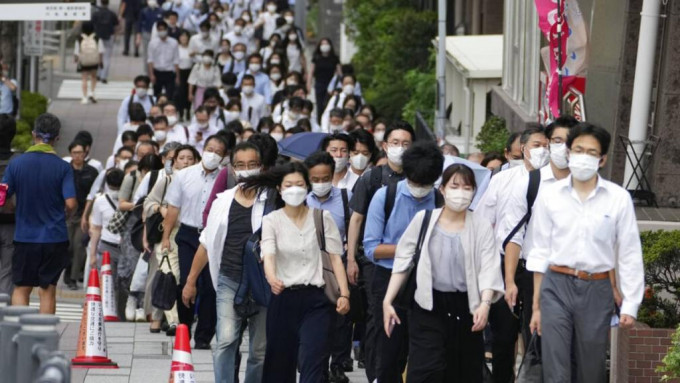 日本疫情反覆。AP圖片