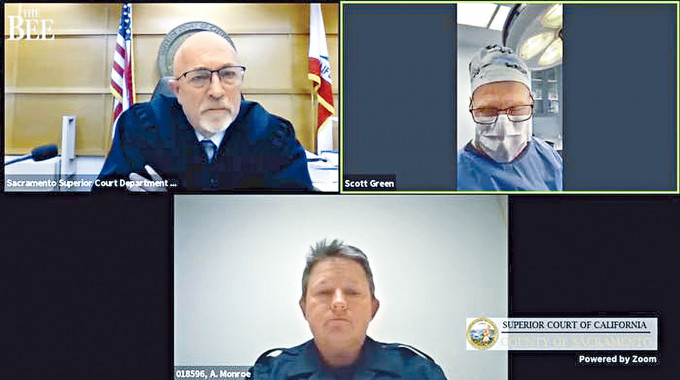 ■格林（右上）替病人动手术时，透过Zoom视像系统出席聆讯。