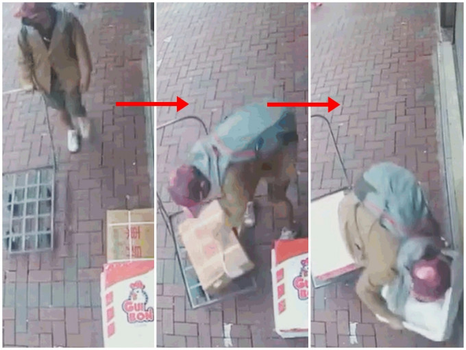 一名戴Cap帽的男子，推手推车取走一间餐厅门外的货物。影片截图
