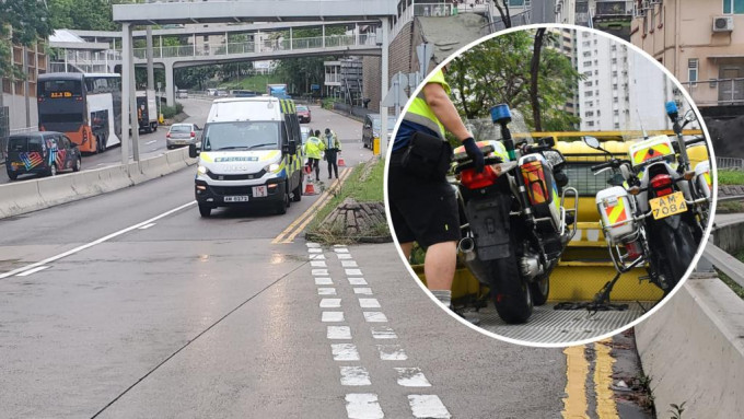 两辆警察电单车疑天雨路滑跣軚。徐裕民摄