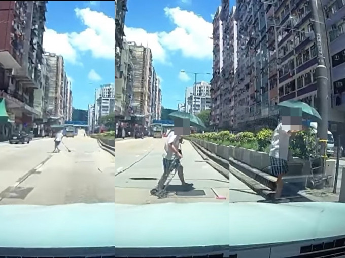 一名男子突然衝出馬路，再轉身返回路中心的石壆上。 網民 Wai Hang Nicholas Ng 影片截圖