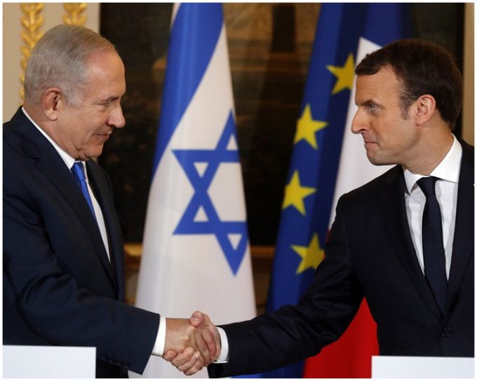 法國總統馬克龍周日接見到訪的以色列總理內塔尼亞胡。AP