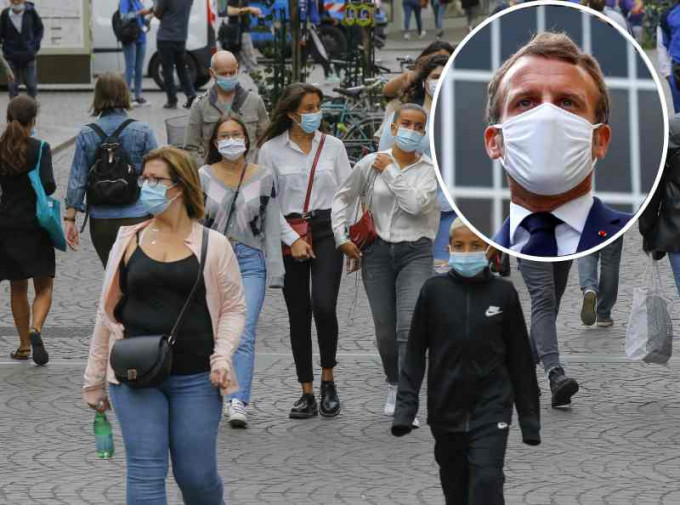 马克龙戴上口罩敦促民众要认真应对疫情。AP