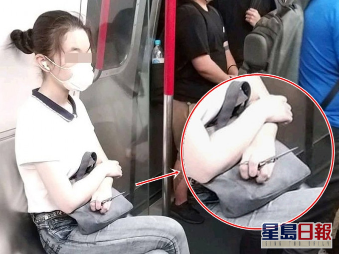 女子手持7吋長利剪鉸剪頭向外坐在車廂內。圖:網民 林朝偉