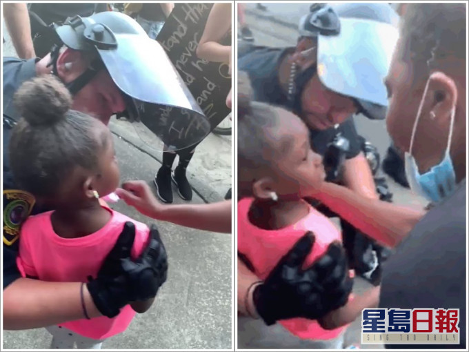 白人警摟住女童安撫。twitter