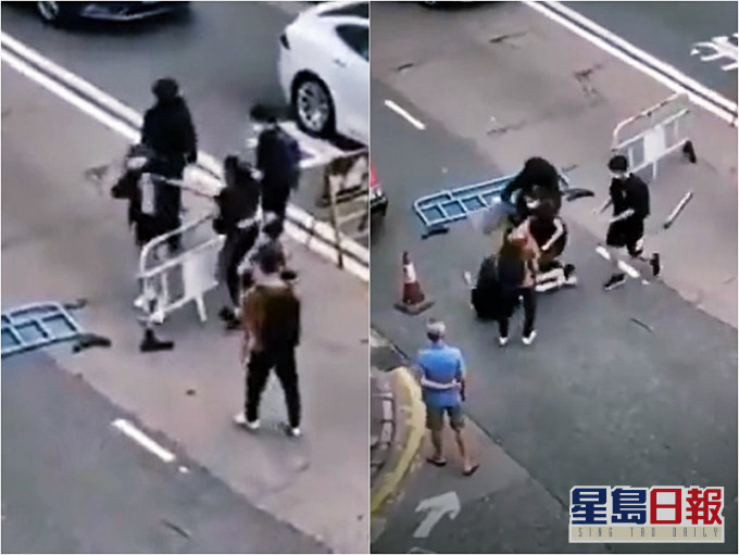 女子清理路障时遭殴打。资料图片