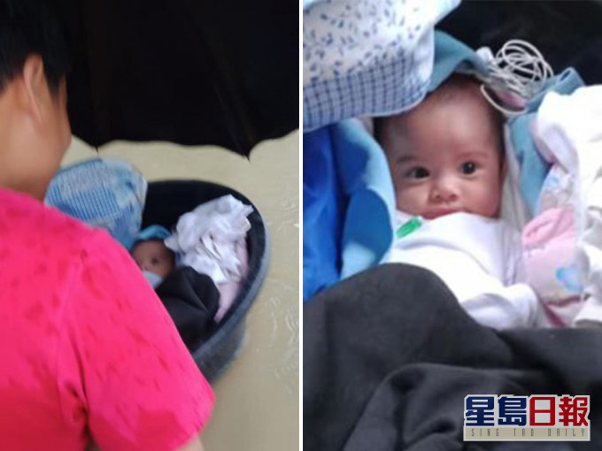 颱風吹襲多處水浸,馬尼拉一名母親將3個月大B女放浴盆運到安全地方。