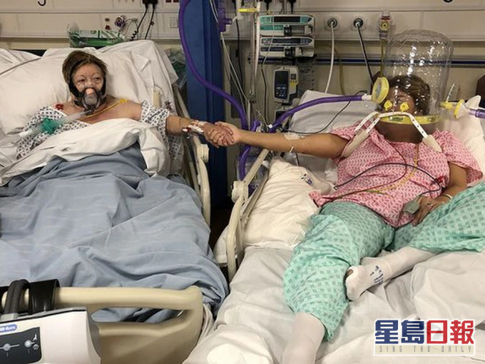 一家三代全染疫,英国母女病牀上牵手诀别。(网图)