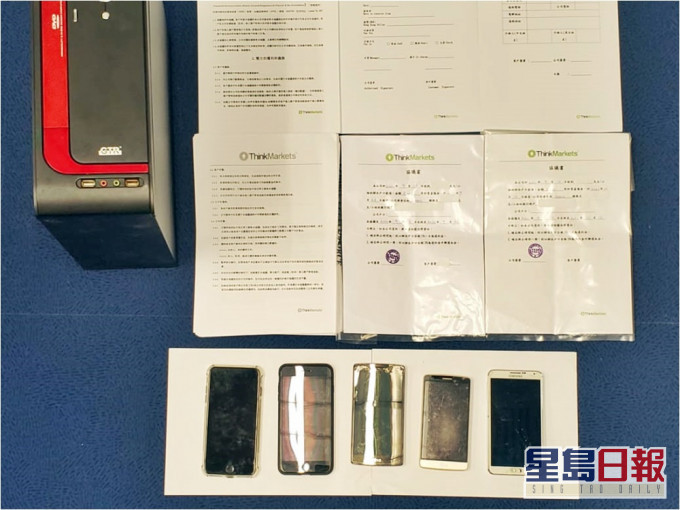 警方拘捕3男1女,涉嫌假冒銀行職員行騙。警方圖片