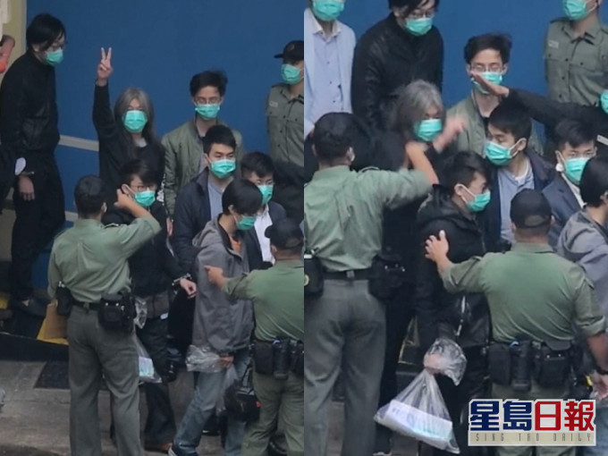 長毛高舉勝利手勢時被懲教職員喝止。