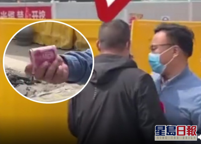 河南记者采访地盘事故期间,疑被工作人员拉扯及塞入现金。影片截图