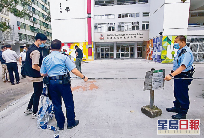案發校門外現場遺下橙色漆油。資料圖片
