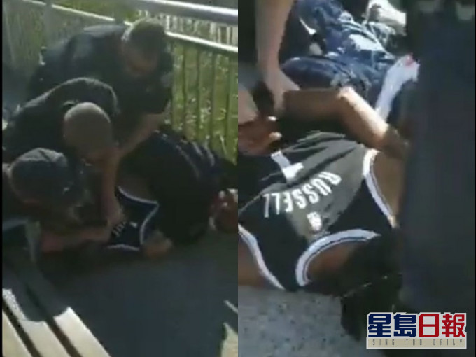 有途人拍攝到4名警員聯手制服一名黑人男子。影片截圖