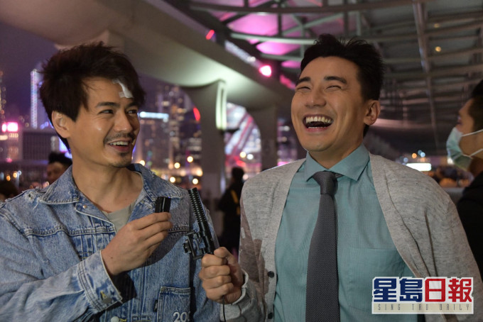 罗仲谦同洪永城开工笑不停。
