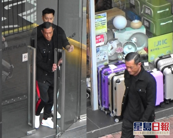 古仔在经理人Ronnie陪同下离开航空大厦。