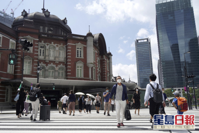 男子从香港入境日本后确诊,其日本同住的家人也确诊。AP图片
