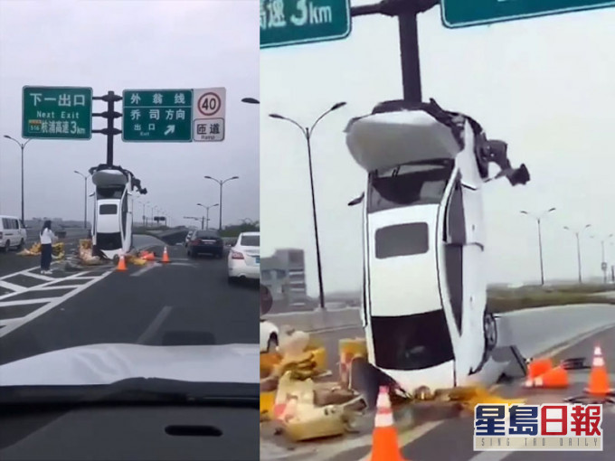 離奇意外,女司機將車開上路牌杆上。(網圖)