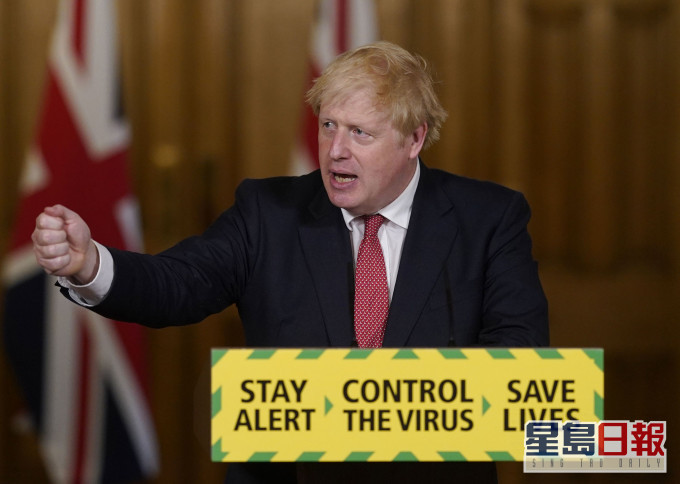 英國首相約翰遜盼聖誕前經濟活動回復正常。 AP