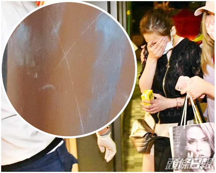 女戶主頸及肩傷受傷送院治理。小圖為涉案單位大門有一個「X」記號。